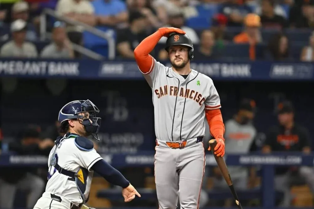 San Francisco's Patrick Bailey taps his helmet after a strike against Tampa Bay Rays.